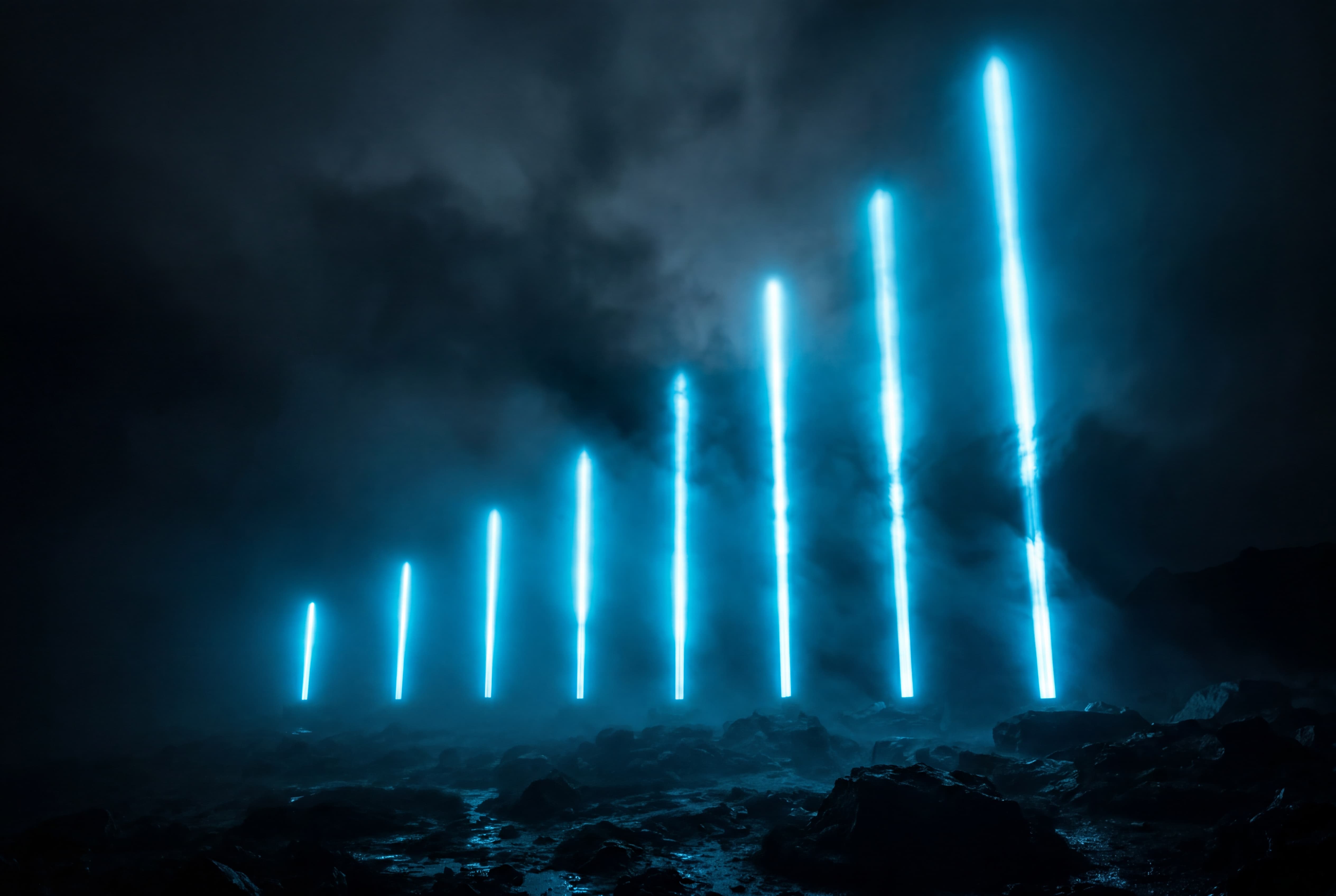 Ascending beams of blue light in dark fog